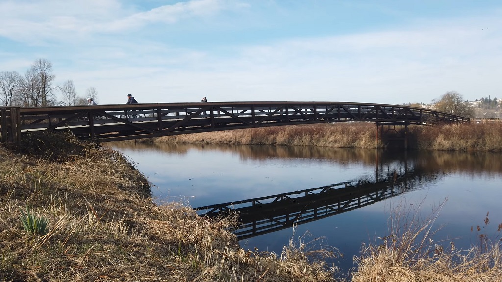 Bridge crossing the river on North Trail at Colony Farm Regional Park