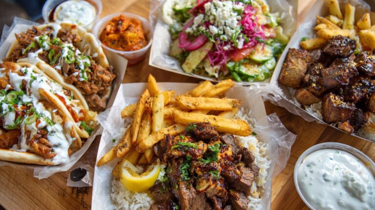 A spread of affordable meals in Vancouver including gyros, rice bowls with fries, salad, grilled meat, and dipping sauces