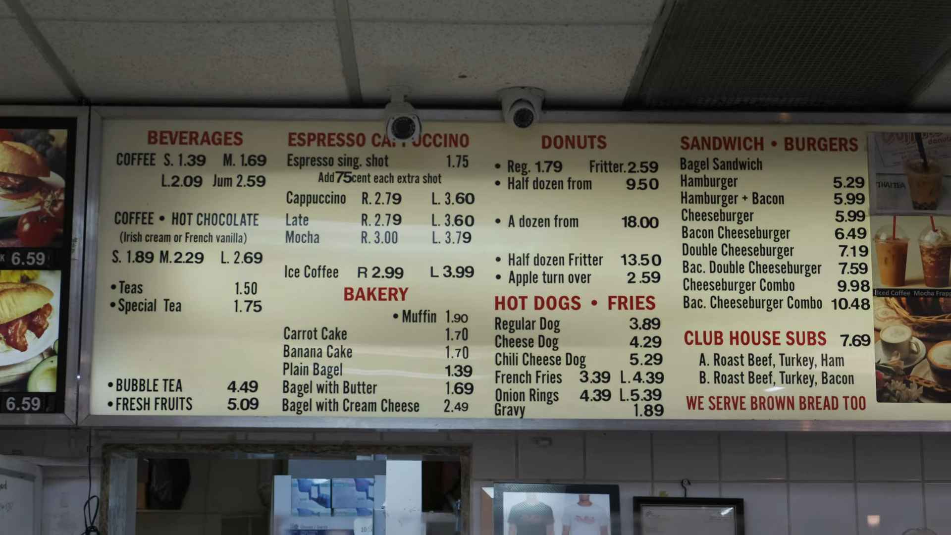 Overhead menu at Duffin’s Donuts showing drinks, donuts, burgers, hot dogs, fries, and sandwiches