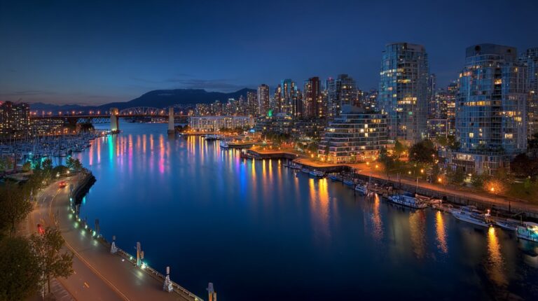 Night view of Vancouver skyline reflecting on the water